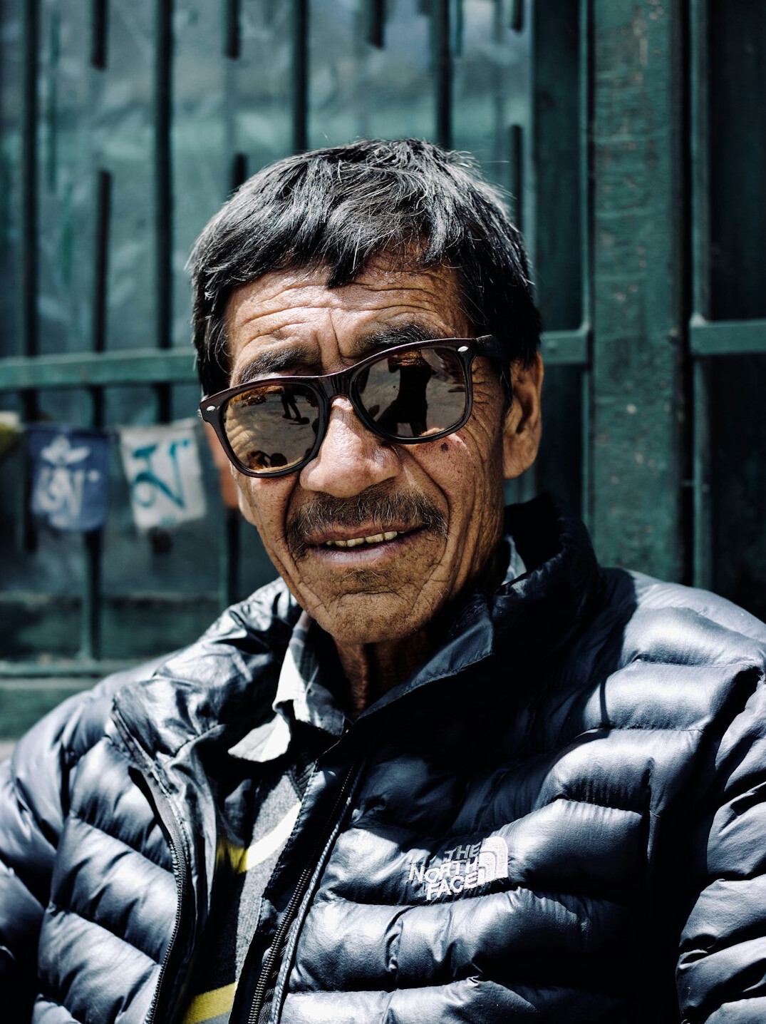 Portuguese man in his fifties wearing glasses, professional portrait